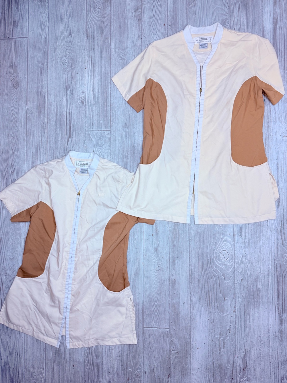 2 Disney cast member house keeping work shirts small and xs one has some marks